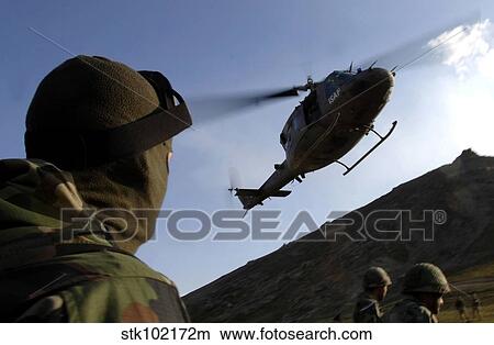 The arrival of an Italian UH-60 helicopter. View Large Photo Image Picture - The arrival of an Italian UH-60 helicopter.. Fotosearch