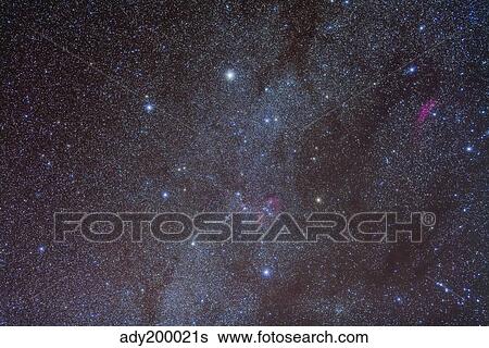 Stock Photograph - The Auriga constellation showing lanes of dark nebulosity.. Fotosearch