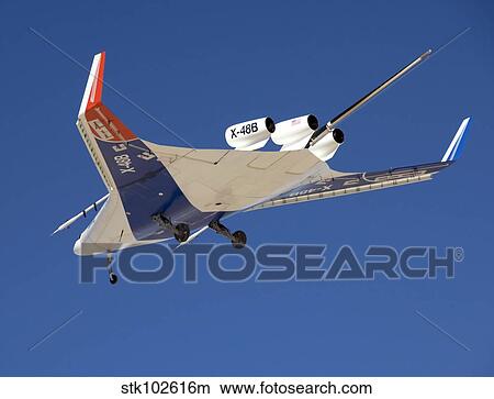 The Blended Wing Body X-48B soars through the sky. View Large Photo Image Picture - The Blended Wing Body X-48B soars through the sky.. Fotosearch