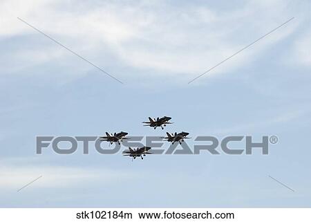 The Blue Angels perform aerial demonstrations during an air show. View Large Photo Image Picture - The Blue Angels perform aerial demonstrations during an air show.. Fotosearch