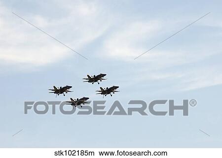 The Blue Angels perform aerial demonstrations during an air show. View Large Photo Image Picture - The Blue Angels perform aerial demonstrations during an air show.. Fotosearch