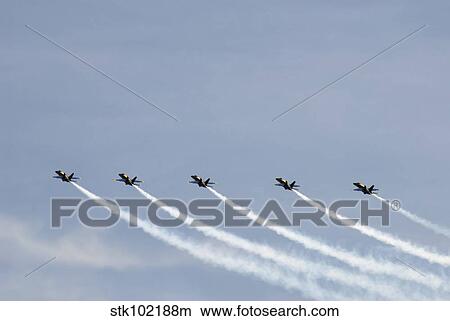 The Blue Angels perform aerial demonstrations during an air show. View Large Photo Image Picture - The Blue Angels perform aerial demonstrations during an air show.. Fotosearch