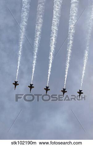 The Blue Angels perform aerial demonstrations during an air show. View Large Photo Image Picture - The Blue Angels perform aerial demonstrations during an air show.. Fotosearch