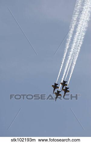 The Blue Angels perform aerial demonstrations during an air show. View Large Photo Image Picture - The Blue Angels perform aerial demonstrations during an air show.. Fotosearch