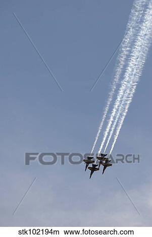 The Blue Angels perform aerial demonstrations during an air show. View Large Photo Image Picture - The Blue Angels perform aerial demonstrations during an air show.. Fotosearch