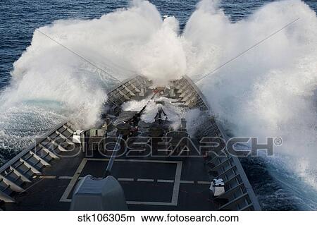 The bow of USS Cowpens plows through a wave in rough seas. View Large Photo Image Picture - The bow of USS Cowpens plows through a wave in rough seas.. Fotosearch