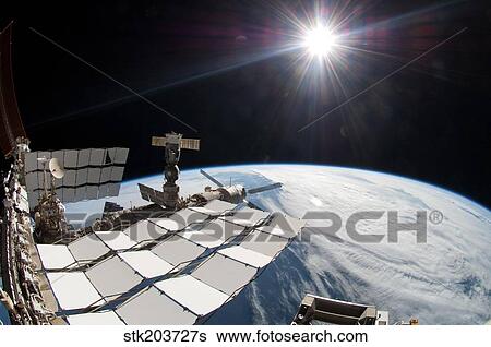 The bright sun, a portion of the International Space Station and Earth's horizon. View Large Photo Image Stock Photograph - The bright sun, a portion of the International Space Station and Earth's horizon.. Fotosearch