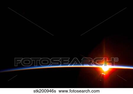 The bright sun dissects the airglow above Earth's horizon. View Large Photo Image Stock Photograph - The bright sun dissects the airglow above Earth's horizon.. Fotosearch