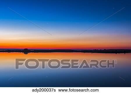 The circumpolar star Capella Crawling Lake reservoir, Alberta, Canada. View Large Photo Image Stock Photograph - The circumpolar star Capella Crawling Lake reservoir, Alberta, Canada.. Fotosearch
