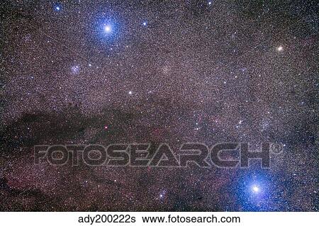 Stock Photograph - The Coalsack and Jewel Box Cluster in the Southern Cross.. Fotosearch