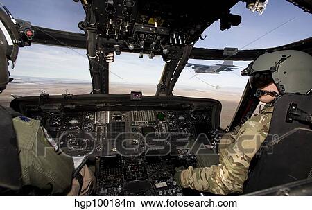 The crew of an HH-60G Pave Hawk prepare to conduct aerial refueling. View Large Photo Image Picture - The crew of an HH-60G Pave Hawk prepare to conduct aerial refueling.. Fotosearch