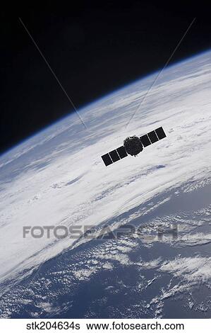 The Cygnus spacecraft begins its separation from the International Space Station. View Large Photo Image Stock Photograph - The Cygnus spacecraft begins its separation from the International Space Station.. Fotosearch