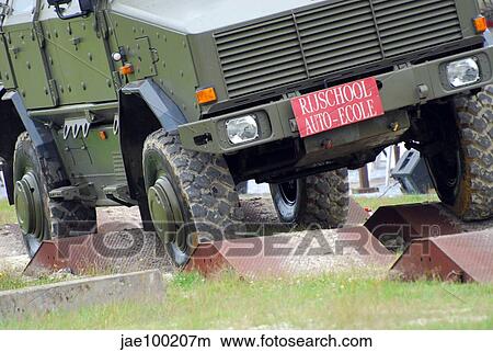 The Dingo 2 MPPV of the Belgian Army on rough terrain. View Large Photo Image Picture - The Dingo 2 MPPV of the Belgian Army on rough terrain.. Fotosearch