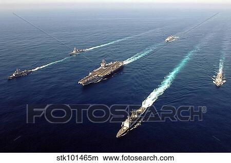 The Enterprise Carrier Strike group sails through the Atlantic Ocean in formation. View Large Photo Image Picture - The Enterprise Carrier Strike group sails through the Atlantic Ocean in formation.. Fotosearch