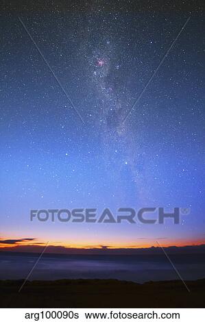 The Eta Carina nebula and the Milky Way visible at dawn. View Large Photo Image Stock Photograph - The Eta Carina nebula and the Milky Way visible at dawn.. Fotosearch