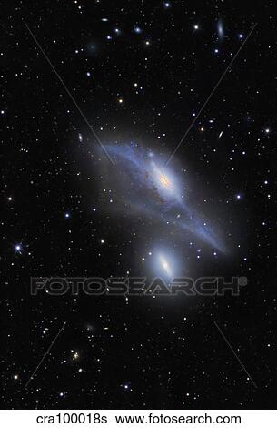 The Eyes Galaxies (NGC 4435 and NGC 4438). View Large Photo Image Stock Photograph - The Eyes Galaxies (NGC 4435 and NGC 4438).. Fotosearch