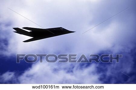 Picture - The F-117A Nighthawk climbs into the clouds during a Rim of the Pacific exercise.. Fotosearch