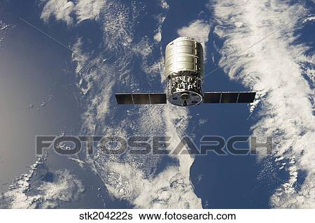 The first Cygnus commercial cargo spacecraft in orbit above Earth. View Large Photo Image Stock Photograph - The first Cygnus commercial cargo spacecraft in orbit above Earth.. Fotosearch