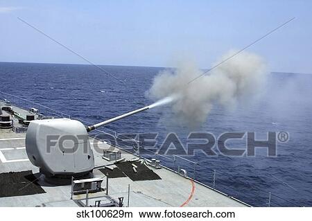 The guided missile destroyer USS Spruance fires its 5' 54 gun. View Large Photo Image Picture - The guided missile destroyer USS Spruance fires its 5' 54 gun.. Fotosearch
