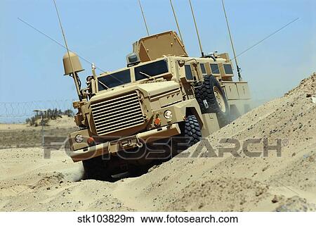 The Joint Explosive Ordnance Disposal Rapid Response Vehicle navigates over rough terrain. View Large Photo Image Picture - The Joint Explosive Ordnance Disposal Rapid Response Vehicle navigates over rough terrain.. Fotosearch