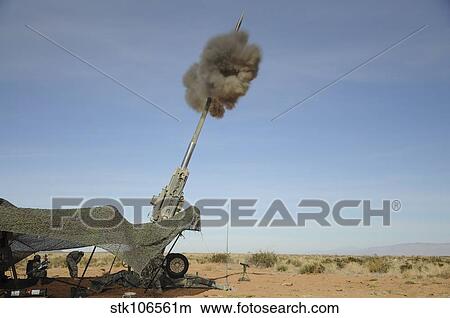 The M982 Excalibur 155mm round leaves the barrel of an M777 Howitzer. View Large Photo Image Picture - The M982 Excalibur 155mm round leaves the barrel of an M777 Howitzer.. Fotosearch