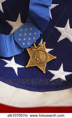 The Medal of Honor rests on a flag during preparations for an award ceremony. View Large Photo Image Picture - The Medal of Honor rests on a flag during preparations for an award ceremony.. Fotosearch