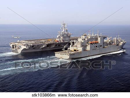 Picture - The Military Sealift Command dry cargo and ammunition ships conduct a vertical replenishment.. Fotosearch