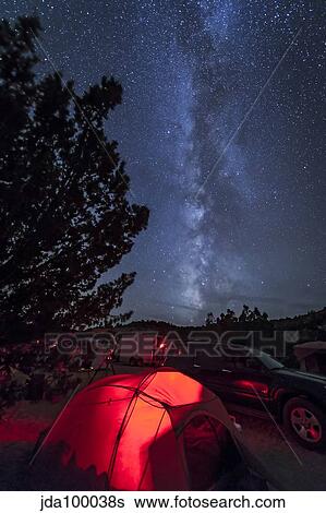 The Milky Way sets behind a tent all aglow, Oklahoma. View Large Photo Image Stock Photograph - The Milky Way sets behind a tent all aglow, Oklahoma.. Fotosearch