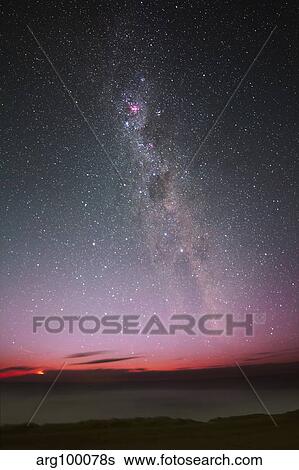 Stock Photograph - The Milky Way with an aurora, a meteor and lightning.. Fotosearch