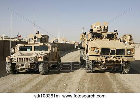 Picture - The Mine Resistant Ambush Protected All Terrain Vehicle and its predecessor, the humvee.. Fotosearch