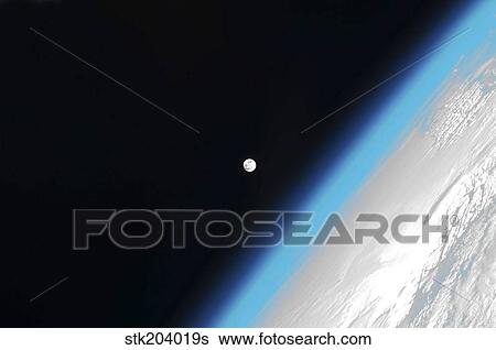 Stock Photograph - The moon and Earth's atmosphere.. Fotosearch