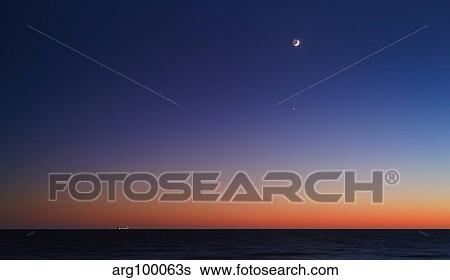 The Moon, Venus and Regulus in conjunction over Buenos Aires. View Large Photo Image Stock Photograph - The Moon, Venus and Regulus in conjunction over Buenos Aires.. Fotosearch