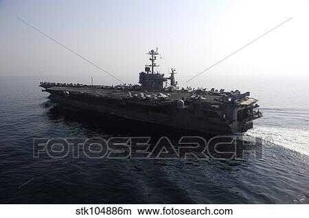 The Nimitz-class aircraft carrier USS John C. Stennis transits the Arabian Gulf. View Large Photo Image Picture - The Nimitz-class aircraft carrier USS John C. Stennis transits the Arabian Gulf.. Fotosearch