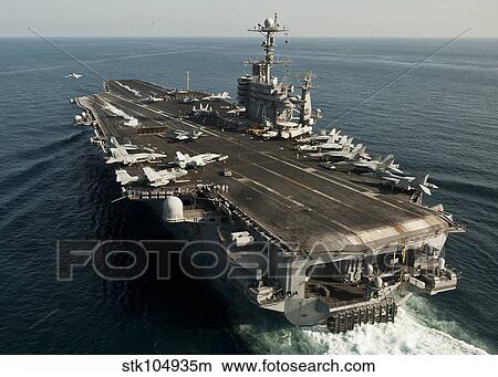 The Nimitz-class aircraft carrier USS John C. Stennis transits the Arabian Sea. View Large Photo Image Picture - The Nimitz-class aircraft carrier USS John C. Stennis transits the Arabian Sea.. Fotosearch