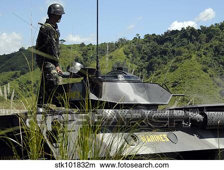 The Philippine Marine Battalion Landing Team fire the weapons systems of a light armored vehicle 300. View Large Photo Image Picture - The Philippine Marine Battalion Landing Team fire the weapons systems of a light armored vehicle 300.. Fotosearch