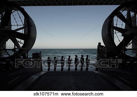 The rifle detail prepares to fire a volley from the well deck of USS Anchorage. View Large Photo Image Picture - The rifle detail prepares to fire a volley from the well deck of USS Anchorage.. Fotosearch