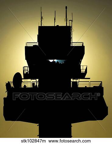 The setting sun silhouettes an air traffic control tower View Large Photo Image Picture - The setting sun silhouettes an air traffic control tower. Fotosearch