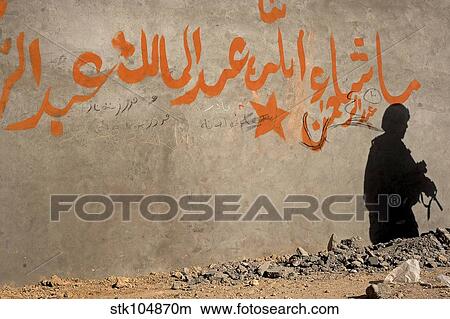 The shadow of a U. S. Army soldier on the wall of an Afghan building. View Large Photo Image Picture - The shadow of a U. S. Army soldier on the wall of an Afghan building.. Fotosearch