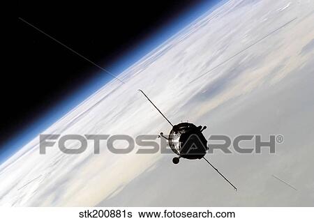 The Soyuz TMA-3 spacecraft orbiting Earth above Russia. View Large Photo Image Stock Photograph - The Soyuz TMA-3 spacecraft orbiting Earth above Russia. . Fotosearch