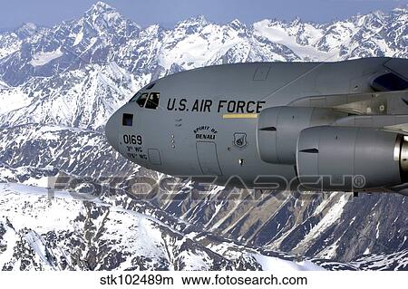 The Spirit of Denali flies over the Alaska Range. View Large Photo Image Picture - The Spirit of Denali flies over the Alaska Range.. Fotosearch