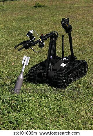 The Talon bomb disposal robot picks up an inert unexploded mortar round. View Large Photo Image Picture - The Talon bomb disposal robot picks up an inert unexploded mortar round.. Fotosearch