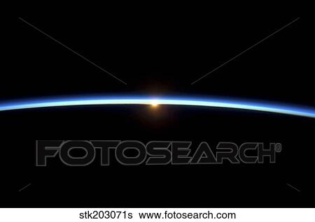 The thin line of Earth's atmosphere and the setting sun. View Large Photo Image Stock Photograph - The thin line of Earth's atmosphere and the setting sun.. Fotosearch