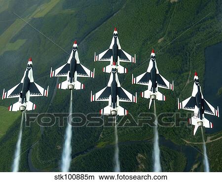 The Thunderbird aerial demonstration team performs a loop while in the Delta formation. View Large Photo Image Picture - The Thunderbird aerial demonstration team performs a loop while in the Delta formation.. Fotosearch