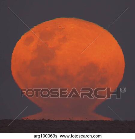 The Thunder's Moon rising over Rio de La Plata, Argentina. View Large Photo Image Stock Photograph - The Thunder's Moon rising over Rio de La Plata, Argentina.. Fotosearch