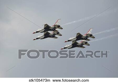 The U. S. Air Force Thunderbirds fly in formation. View Large Photo Image Picture - The U. S. Air Force Thunderbirds fly in formation.. Fotosearch