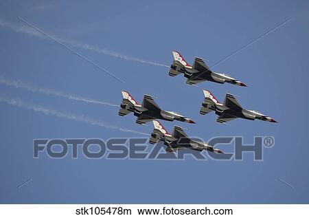 The U. S. Air Force Thunderbirds fly in formation. View Large Photo Image Picture - The U. S. Air Force Thunderbirds fly in formation.. Fotosearch