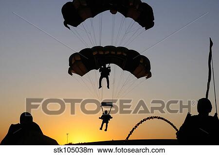 The U. S. Army Golden Knights perform an aerial demonstration and landing. View Large Photo Image Picture - The U. S. Army Golden Knights perform an aerial demonstration and landing.. Fotosearch