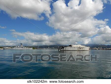 The U. S. Navy's High Speed Vessel Two Swift passes the Battleship Missouri Memorial. View Large Photo Image Picture - The U. S. Navy's High Speed Vessel Two Swift passes the Battleship Missouri Memorial.. Fotosearch