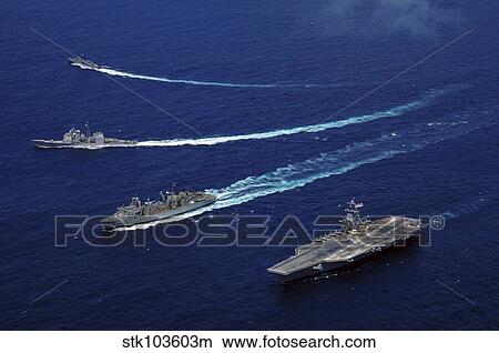 Picture - The USS Bunker Hill, the USNS Rainier, and the BAP Carvajal break away from the aircraft carrier USS Carl Vinson at sea.. Fotosearch