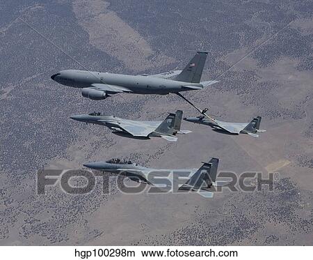 Three F-15 Eagles conduct aerial refueling with a KC-135 Stratotanker. View Large Photo Image Picture - Three F-15 Eagles conduct aerial refueling with a KC-135 Stratotanker.. Fotosearch